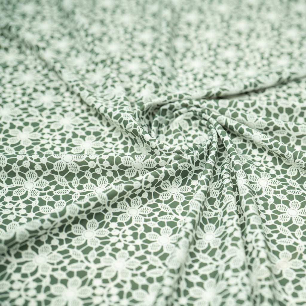 White Flower Lace Pattern on Sage Printed Spandex Fabric | CDW
