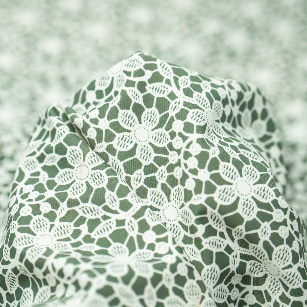 White Flower Lace Pattern on Sage Printed Spandex Fabric | CDW