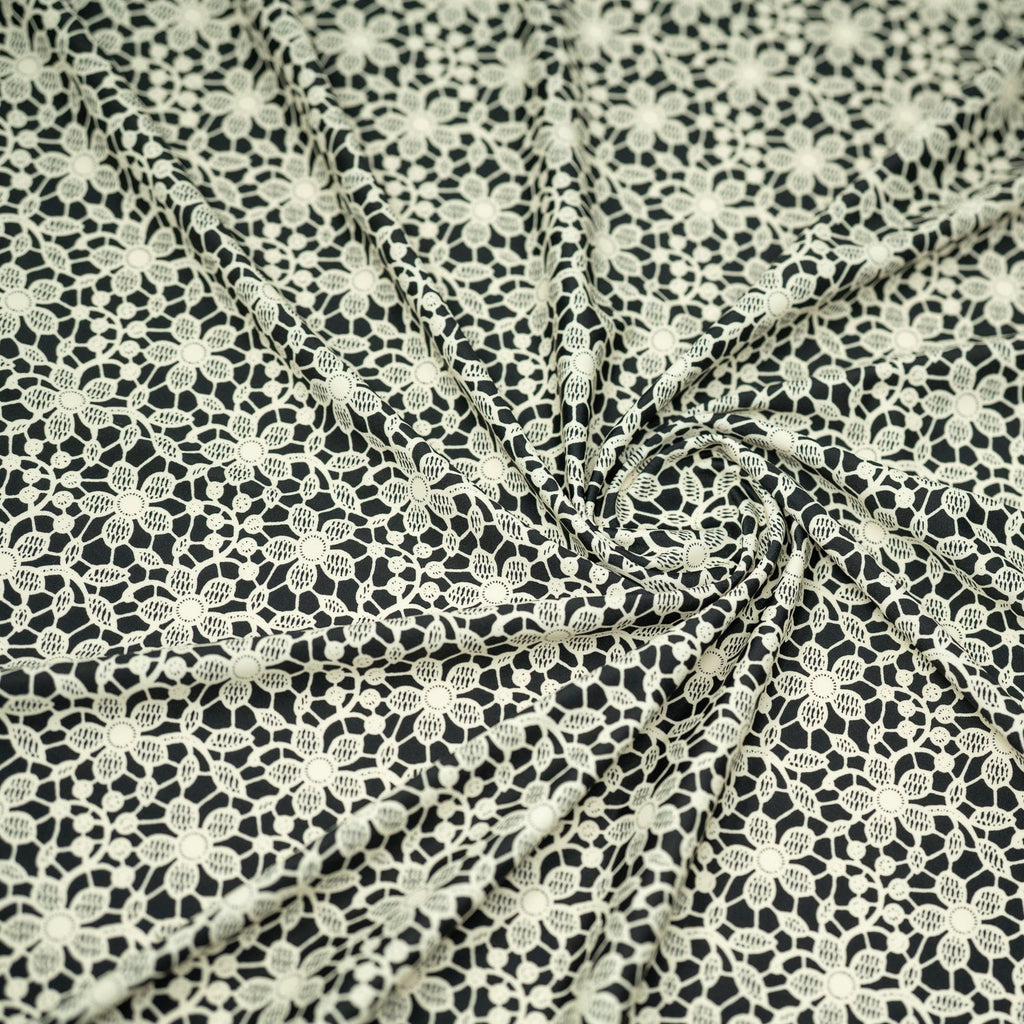 white Flower Lace Pattern on Black Printed Spandex Fabric | CDW