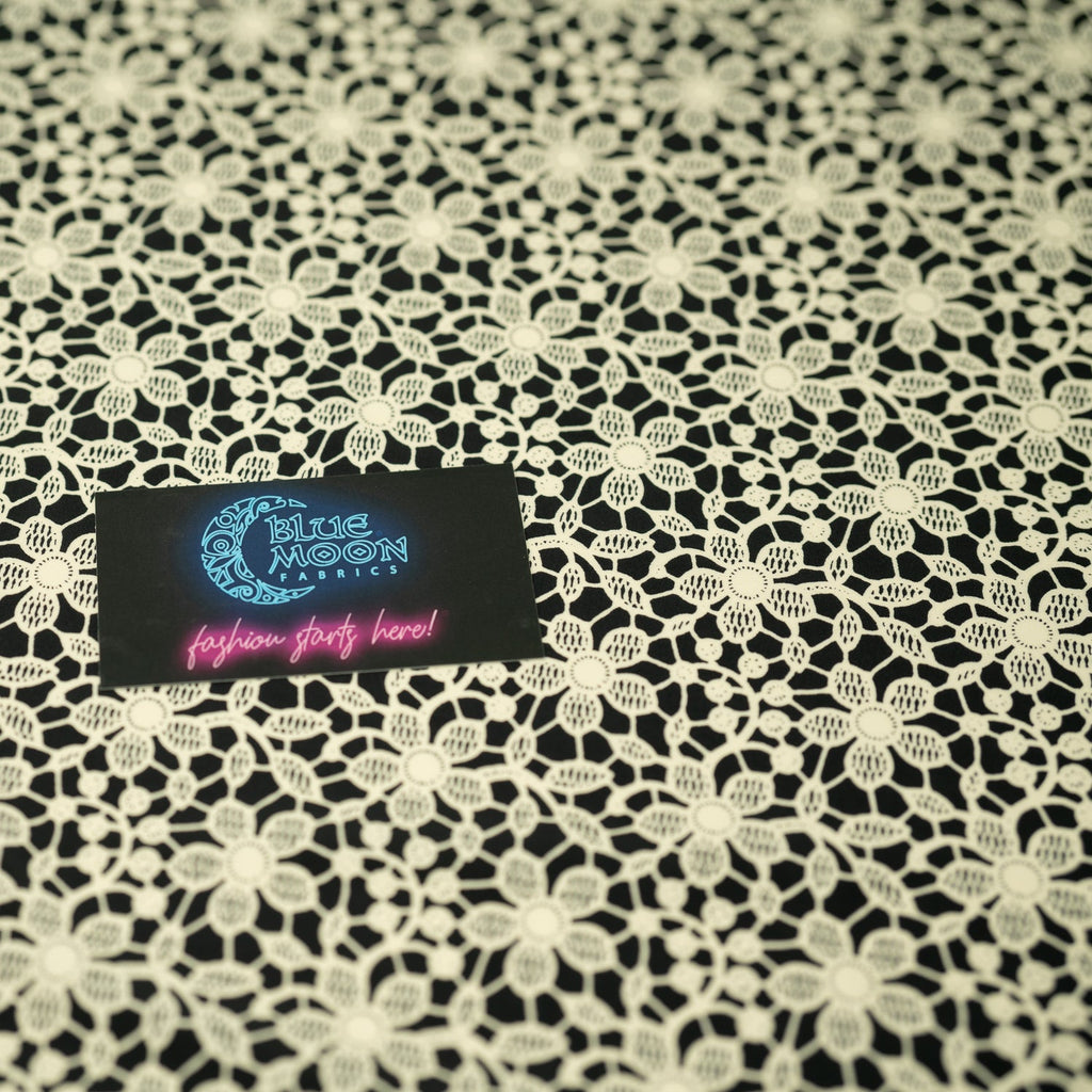Ivory Flower Lace Pattern on Black Printed Spandex Fabric | Blue Moon Fabrics