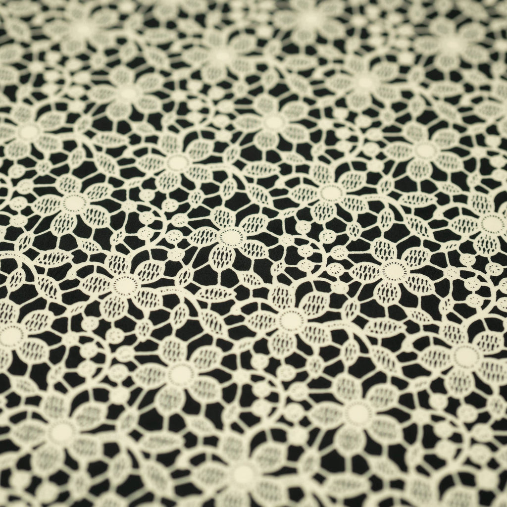 white Flower Lace Pattern on Black Printed Spandex Fabric | CDW