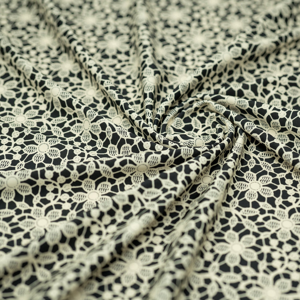 white Flower Lace Pattern on Black Printed Spandex Fabric | CDW