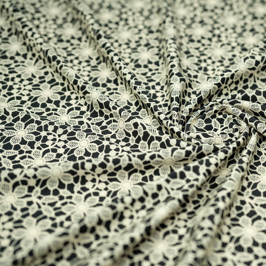 white Flower Lace Pattern on Black Printed Spandex Fabric | CDW